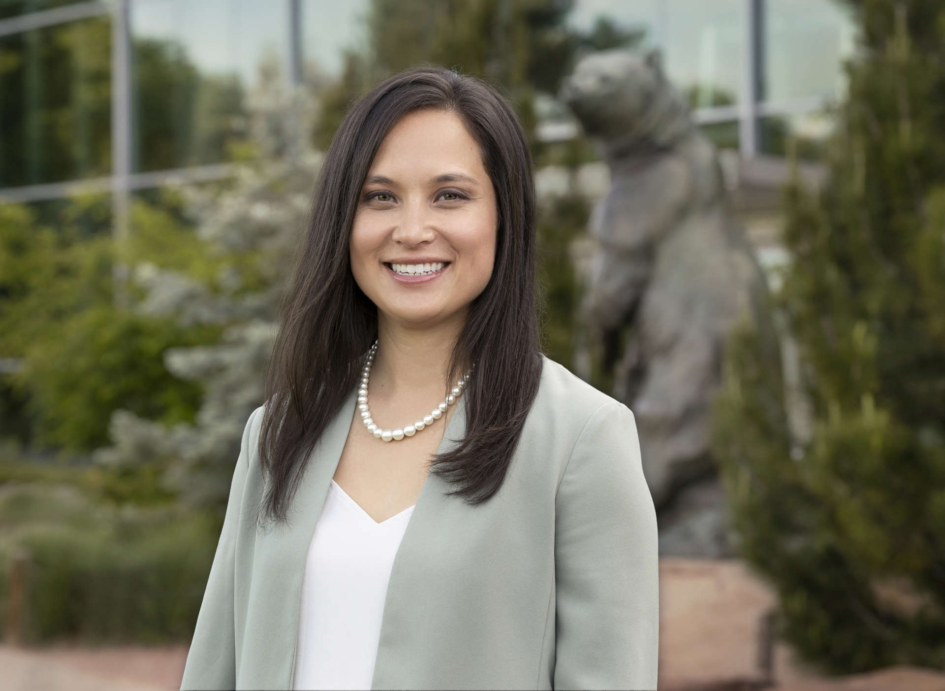 Headshot of Christina Fritts in front of the Denver Museum of Nature and Science