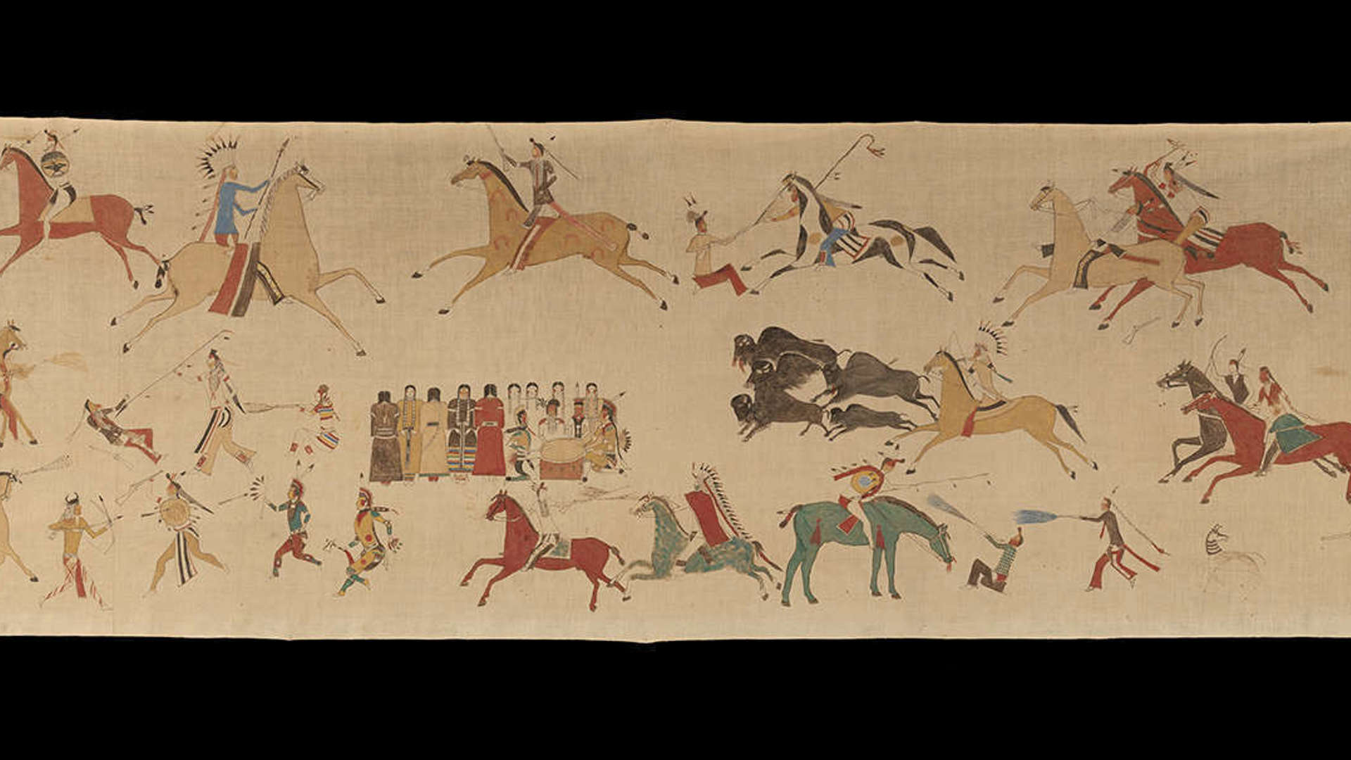 Large brown object with drawings of Native American scenes on a black background