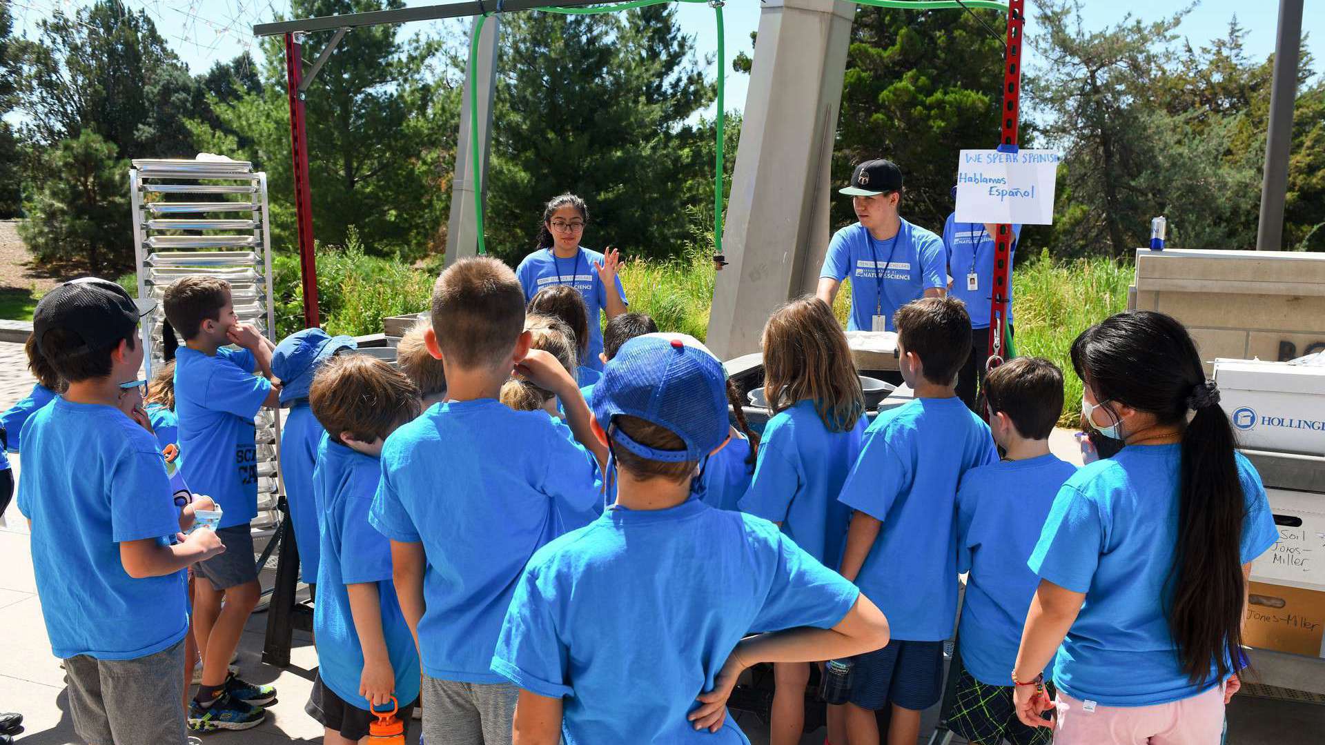 A class of campers meet Teen Science Scholars presenting their summer research findings