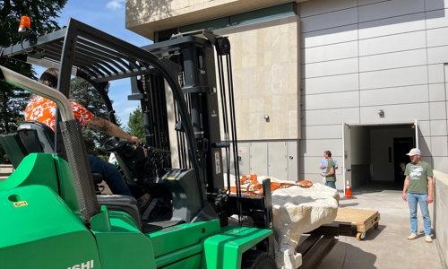 Museum staff unloading the fossil jacket at the Museum