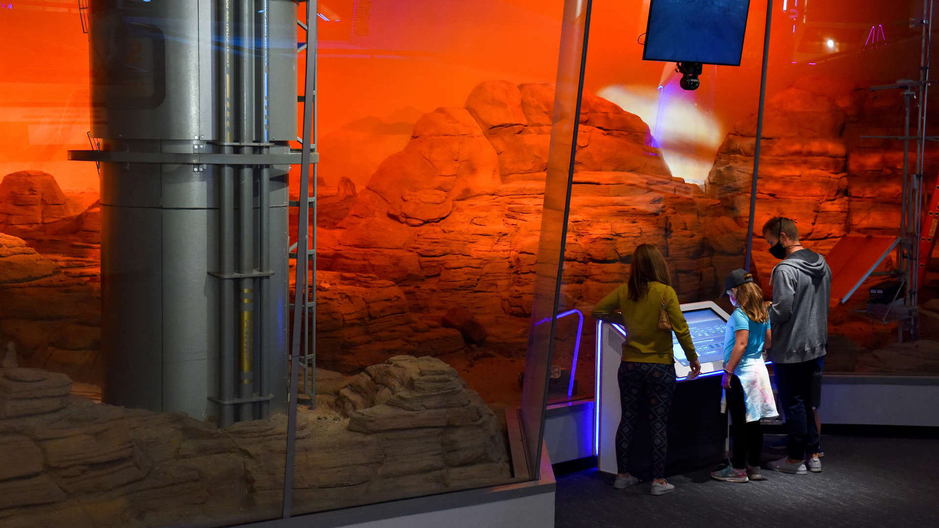 Guests Standing In Front Of The Mars Diorama